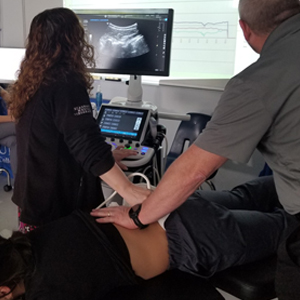 image Augusta chiropractic ultrasound imaging of spinal vertebrae during treatment